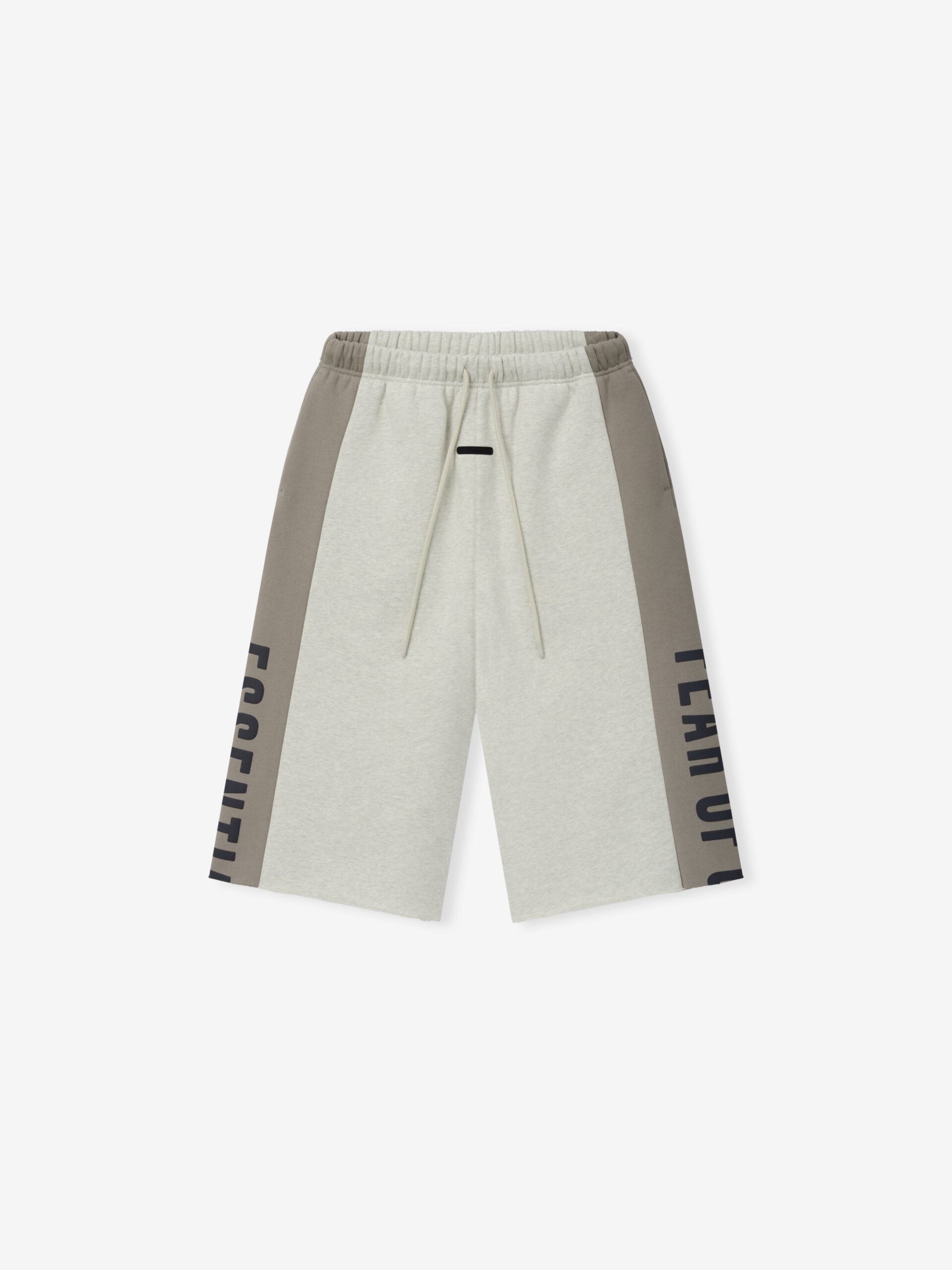 RW00285_PANELLED_RAW_CUT_OFF_SWEATPANT-VANILLA_HEATHER_SEAL_1_cf2567bf-4359-496c-b99d-d56e6bc41122.jpg Fear of God Essentials Panelled Raw Cut Off Sweatpant Vanilla Heather / Seal